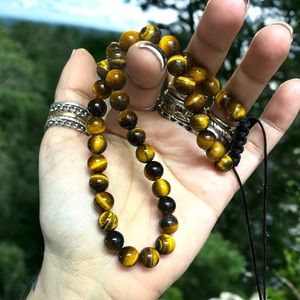 Handmade golden brown tiger eye gemstones adjustable macrame choker necklace .